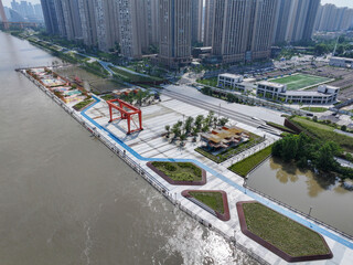 Modern Waterfront City Development with Architecture and Green Space © TranPhuoc