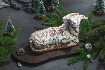Christmas lamb cake with traditional New Year decor. Baked sweet dessert with sugar icing