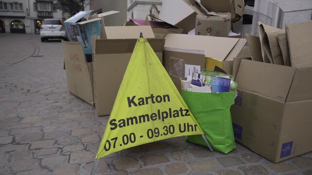 Karton sammelplatz Schweiz. Well-organized cardboard recycling point in Schaffhausen, Switzerland. Sustainable waste management and eco-friendly. Karton Sammelstelle in Altstadt. Recycling. 