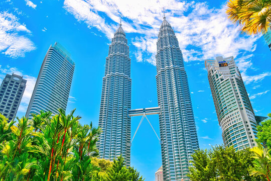 KUALA LUMPUR, MALAYSIA - SEPTEMBERER 14, 2025: Petronas Towers. Petronas Towers, also known as Menara Petronas is the tallest buildings in the world from 1998 to 2004. On a hot day during wet season.