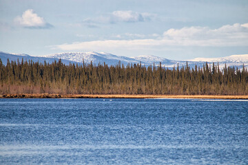 Snow on mountains behind Clearwater Creek