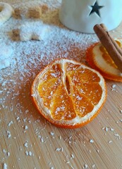 Fresh homemade holiday cookies with sugar powder, dry oranges and spices, Christmas cookie background