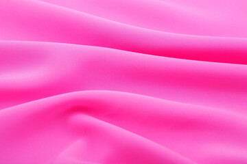 Soft pink satin fabric texture with smooth flowing folds, elegant silky textile ideal for feminine design, luxury branding, beauty packaging, decor.
