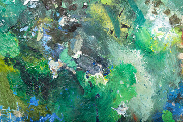Colorful abstract painting painted with palette knife and brush in oil paint in green shades