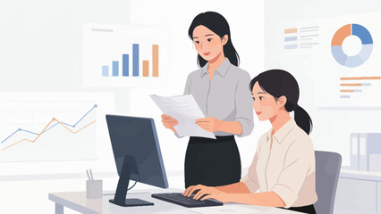 Two women working in an office with data charts