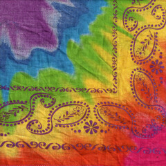 Colorful tie-dye fabric with paisley border, vibrant rainbow textile pattern for boho design, festival themes, craft projects, vintage style graphics, and creative backgrounds.