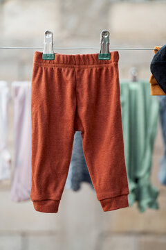 Infant pants hanging with blurred background