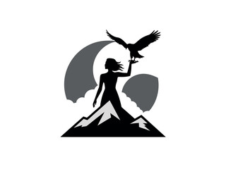 Silhouette of Woman Holding Eagle on Mountain Peak with Sunset Background