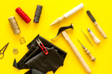 Leather craft or shoemaker tools flat lay. The workplace in a leather workshop