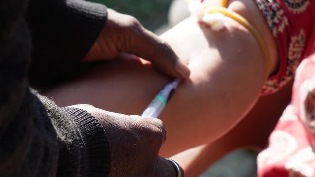 blood is taken from a vein in the arm using a needle