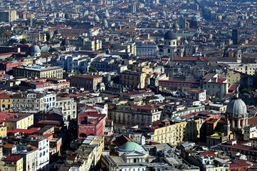 Aerial view of Naples, Italy. rooftops of residential houses and churches. dense cityscape, built environment. travel and tourism. panoramic view from the hill above the city. colorful skyline.