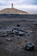 Reykjanes peninsula, Iceland-March 17, 2025:Vertical photograph of Reykjanes Lighthouse seen from the coast in Iceland's Reykjanes Peninsula on a cloudy day