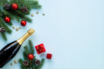 Christmas and New Year festive flat lay with champagne bottle and decoration, top view