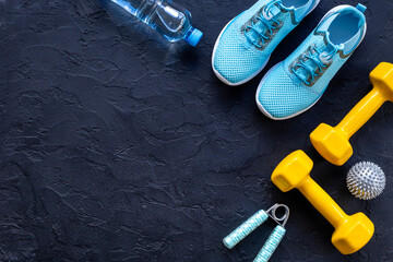 Flat lay of fitness sports equipment. Sneakers and dumbbells for gym. Wellness concept