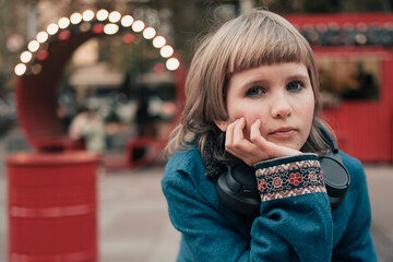 teenage girl with corn dog and hot drink at festival street fair in city