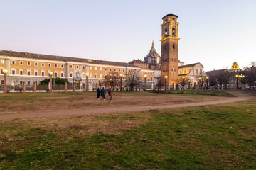 Turin, Italy. Panoramic view from the Palatine Towers Archaeological Park showing the bell tower and dome of the Basilica of Turin, the Chapel of the Holy Shroud and historic museums at dusk.