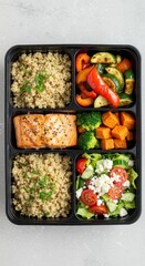 Healthy Meal Prep Box with Salmon and Colorful Vegetables