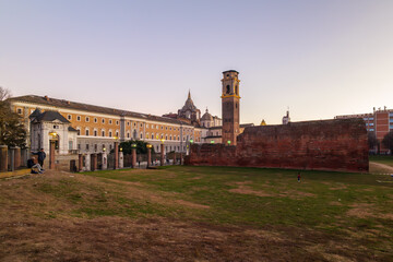 Turin, Italy. Evening view from the Palatine Towers Archaeological Park showing the bell tower and dome of the Basilica of Turin, the Chapel of the Holy Shroud and the Museum of Antiquities.
