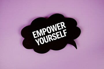 Empower Yourself text with speech bubble top view on purple background