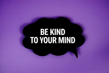 Be Kind To Your Mind text with speech bubble top view on purple background