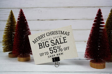 Festive display with small decorative Christmas trees with 