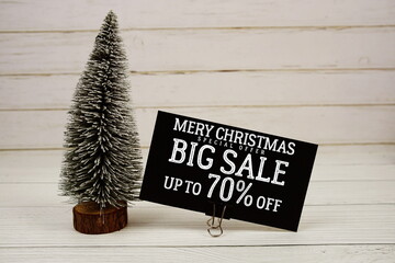 Festive display with small decorative Christmas trees with 