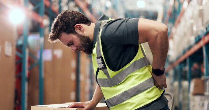 Logistics, back pain or loader in warehouse with injury, spine massage or emergency in supply chain. Accident, flare or man in depot with backache, muscle strain or osteoarthritis in distribution.