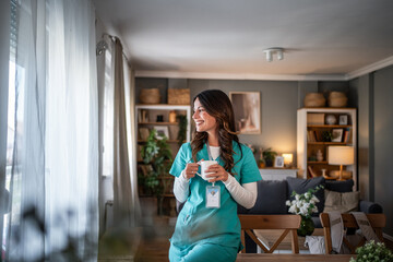 Healthcare worker enjoying coffee break at home