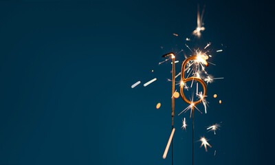 16 years celebration festive background with copy space made with Bengal fires in the form of number Sixteen.