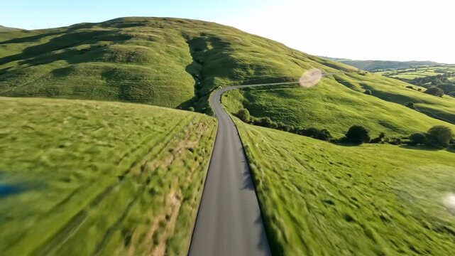 Aerial journey over serpentine mountain road in lush green valley - Powered by Adobe