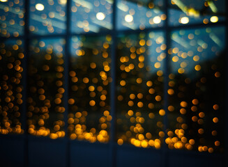 Bokeh lights reflection on diagonal windows blur backdrop