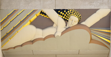 View of a stylized figure reclines amidst geometric rays and cloud-like forms, a study in muted tones punctuated by flashes of gold, New York, New York, United States.