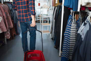 Man shopping for clothes in a secondhand store
