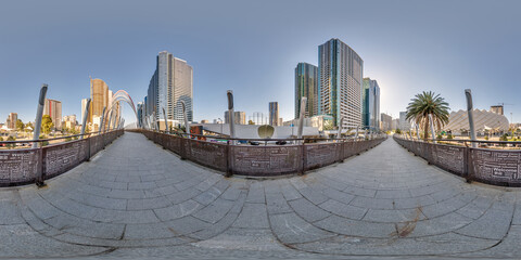 360 hdri seamless panorama on pedestrian path with bridge near skyscrapers with blue sky and good weather in equirectangular spherical projection, ready AR VR virtual reality content