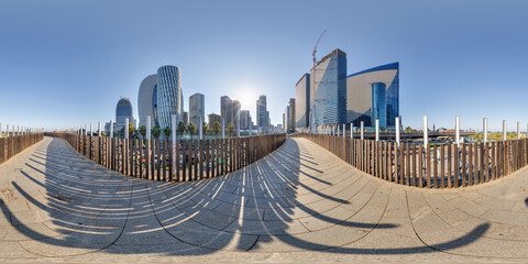 360 hdri seamless panorama on pedestrian path with bridge near skyscrapers with blue sky and good weather in equirectangular spherical projection, ready AR VR virtual reality content