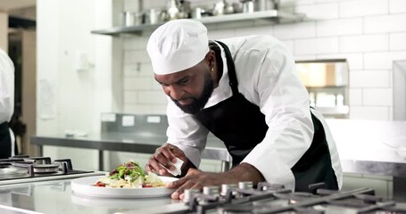 Chef, plating and man with dish, kitchen or culinary skills for food presentation, order and cuisine. Hospitality, cook and person with cloth for smudge removal, gourmet and meal prep in restaurant