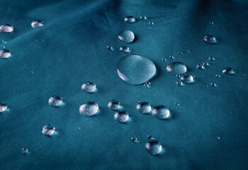 Blue waterproof fabric with raindrops. Fabric for active sports