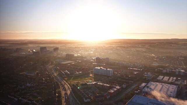 Atmospheric Sunrise Cityscape With Fog and Chimney Steam. Basingstoke. UK