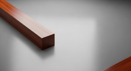 Wooden rectangular prism on a gray surface with dramatic lighting
