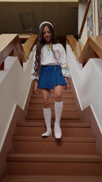 Teenage girl jumping on stairs. Concept of child teenager.
