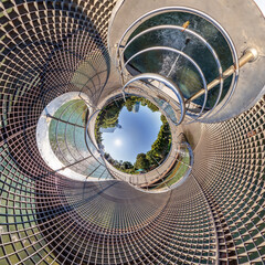 sphere inside overlooking multi-storey buildings of skyscrapers of residential complex, urban development. Transformation of spherical 360 panorama in abstract aerial view.
