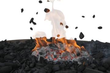 Burning charcoal with orange flames and smoke