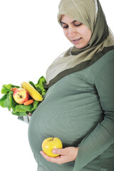 Pregnant muslim woman with healthy food