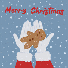Santa Claus holding a gingerbread man cookie with a 'Merry Christmas' inscription