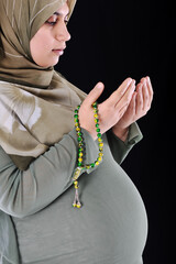 portrait of pregnant muslim woman,prayer