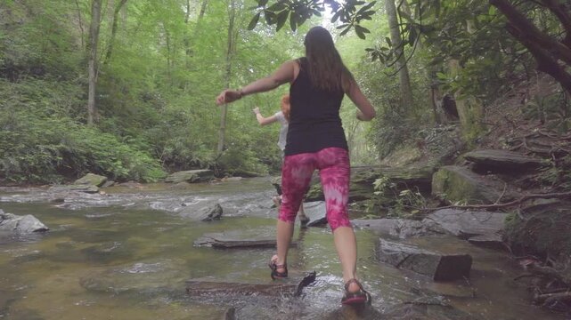 Two Young Girls Hiking and Jumping Rocks in Mountain Creek
