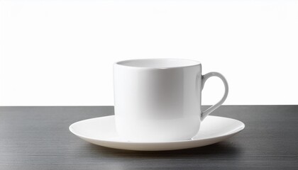 White teacup and saucer on dark table