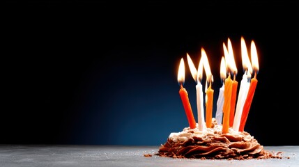 A decadent birthday cake adorned with vibrant candles alight, symbolizing wishes and celebrations, inviting joy and warmth in a personal and memorable birthday setting.