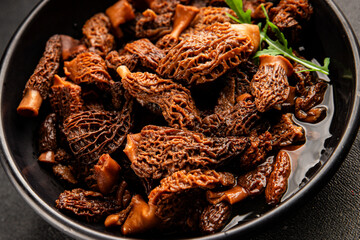 Morels mushrooms natural mushroom healthy food ingredient appetizer fresh tasty gourmet food background on the table rustic food top view copy space keto and paleo diet vegetarian and vegan food