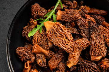 Morels mushrooms natural mushroom healthy food ingredient appetizer fresh tasty gourmet food background on the table rustic food top view copy space keto and paleo diet vegetarian and vegan food